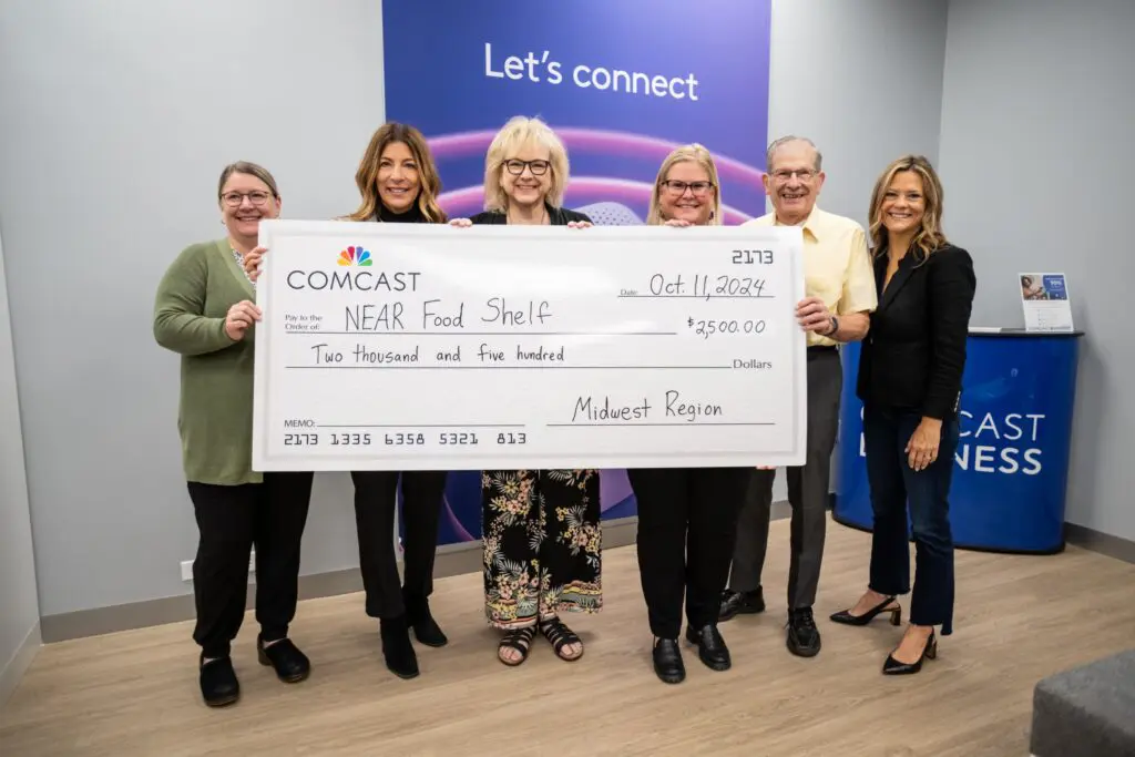 Community members and Comcast employees at Crystal store opening