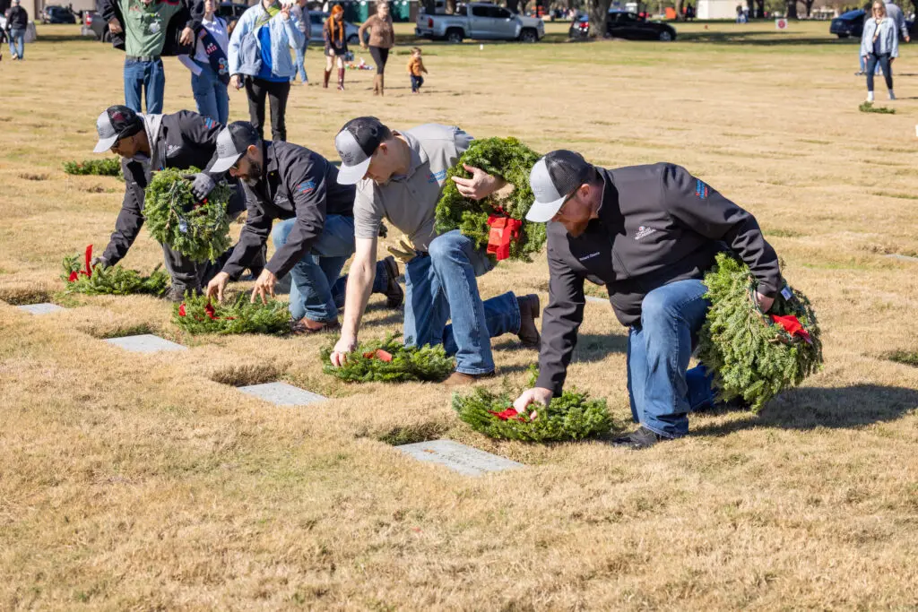 Wreaths being placed on graves