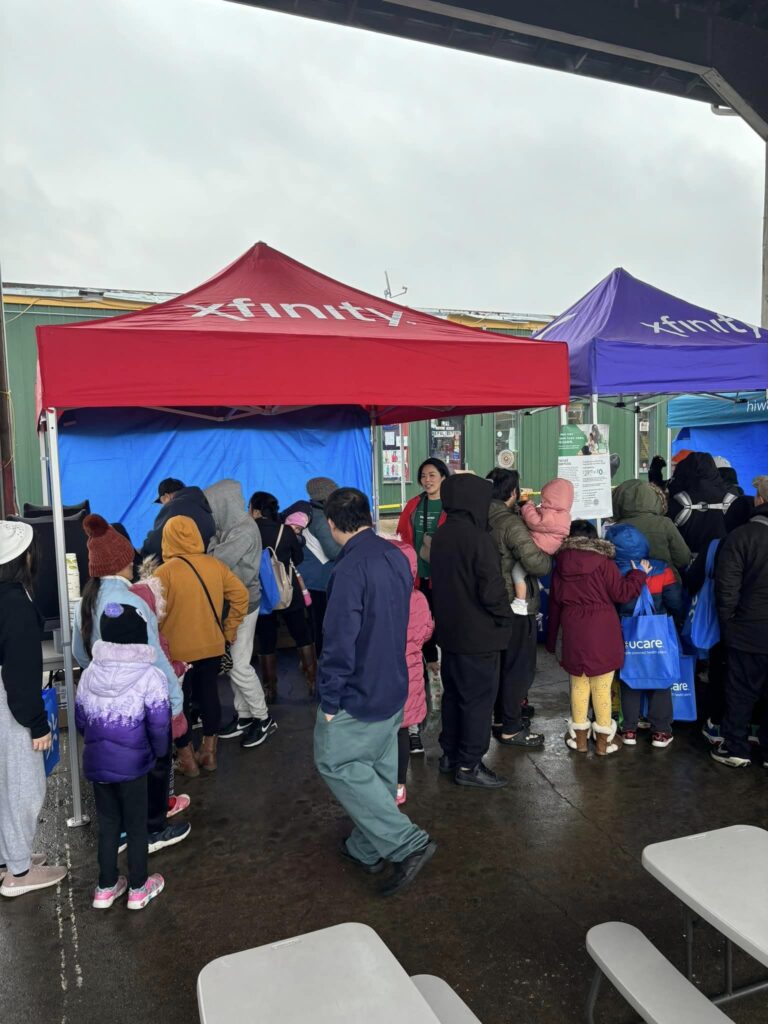 Crowds lined up at the Xfnity table