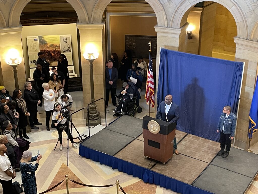 Dameon Campbell, VP of Technical Operations speaks to the audience at the State Capitol Rotunda