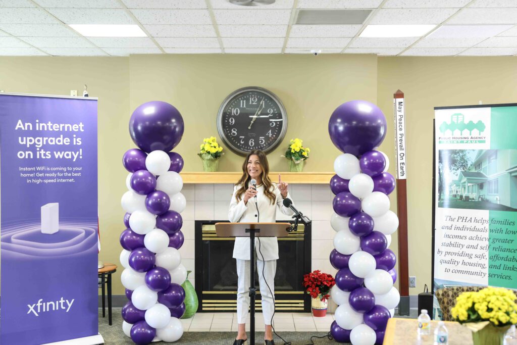 Kalyn Hove, Regional Senior Vice President for Comcast's Midwest Region, speaks during Xfinity’s event for the first collaboration with the St. Paul Public Housing Agency at the Central Hi-Rise apartments in Saint Paul, Minn., on Tuesday, June 11, 2024.