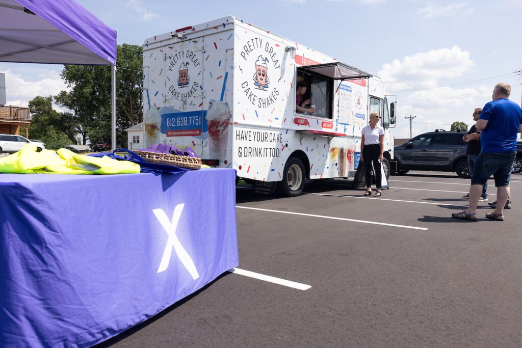 The Great Cake Shakes food truck and Xfinity table.