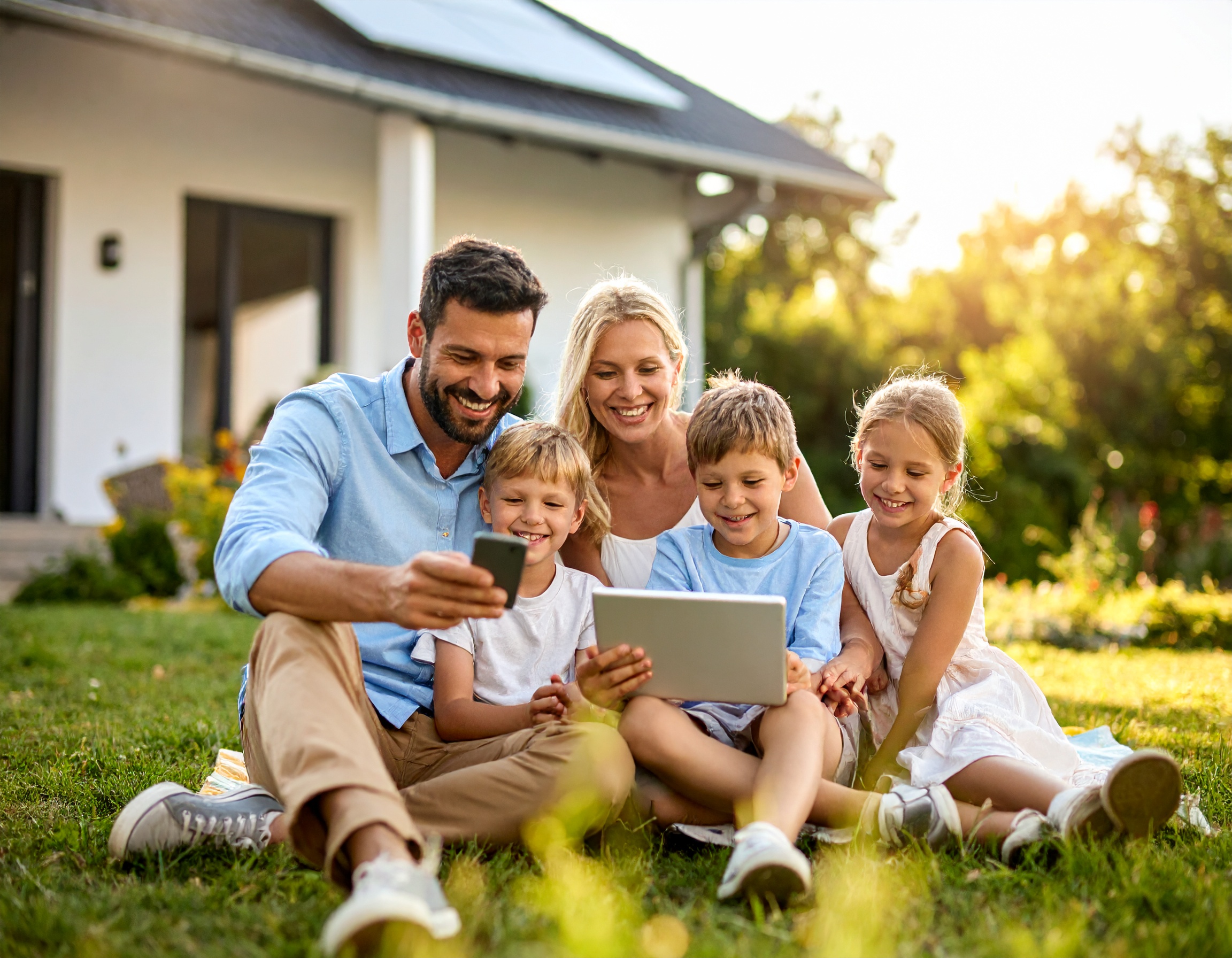Family outside on devices