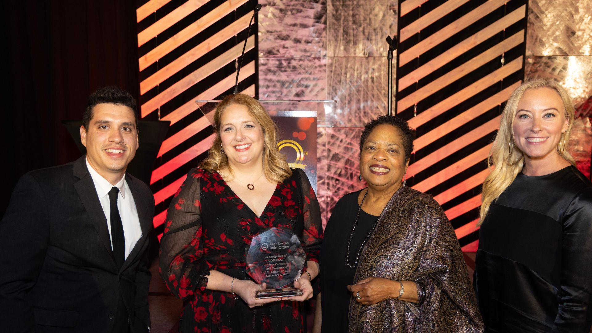 Group of four holding the award
